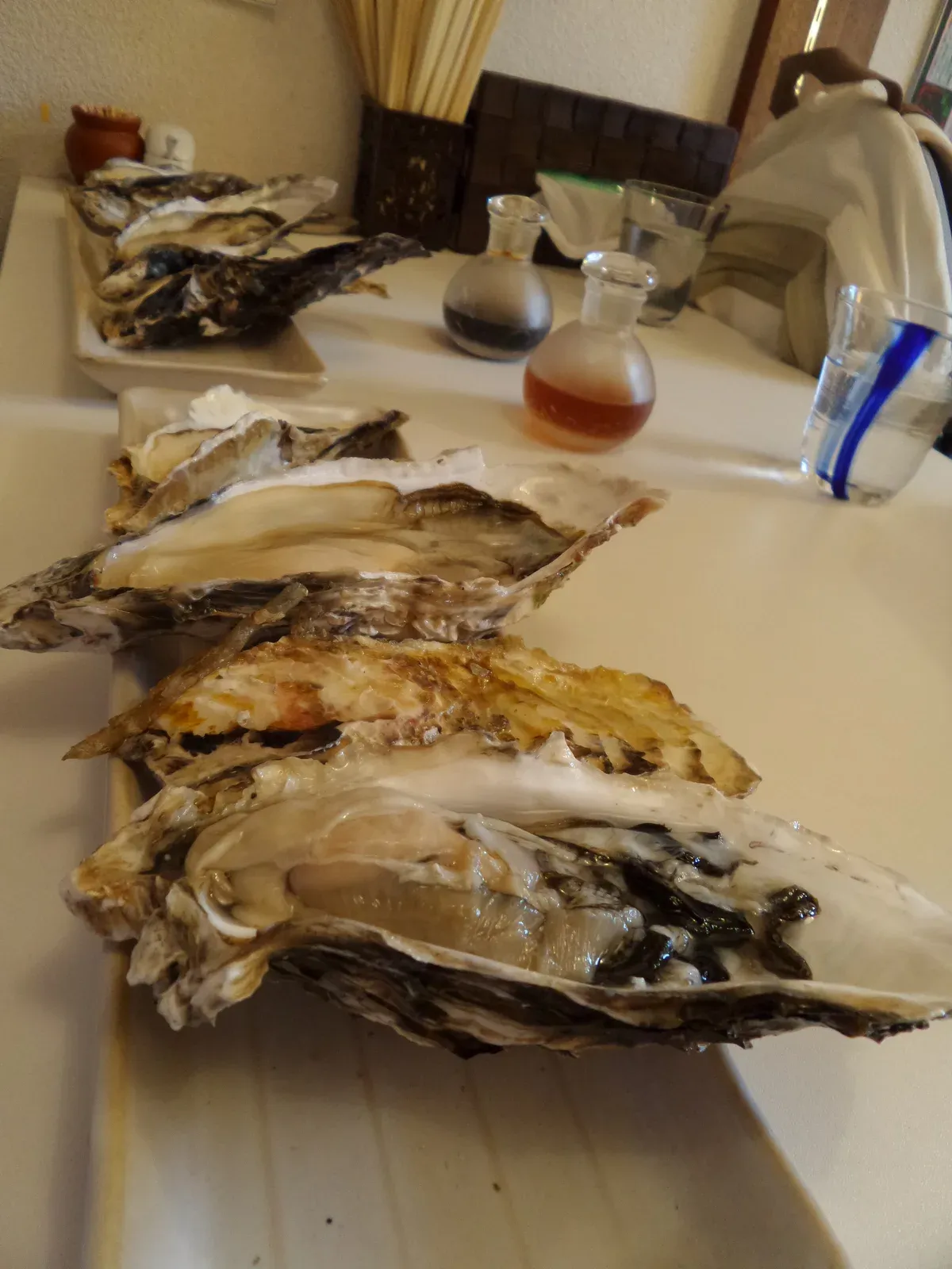 Grilled oysters in their shells on a table
